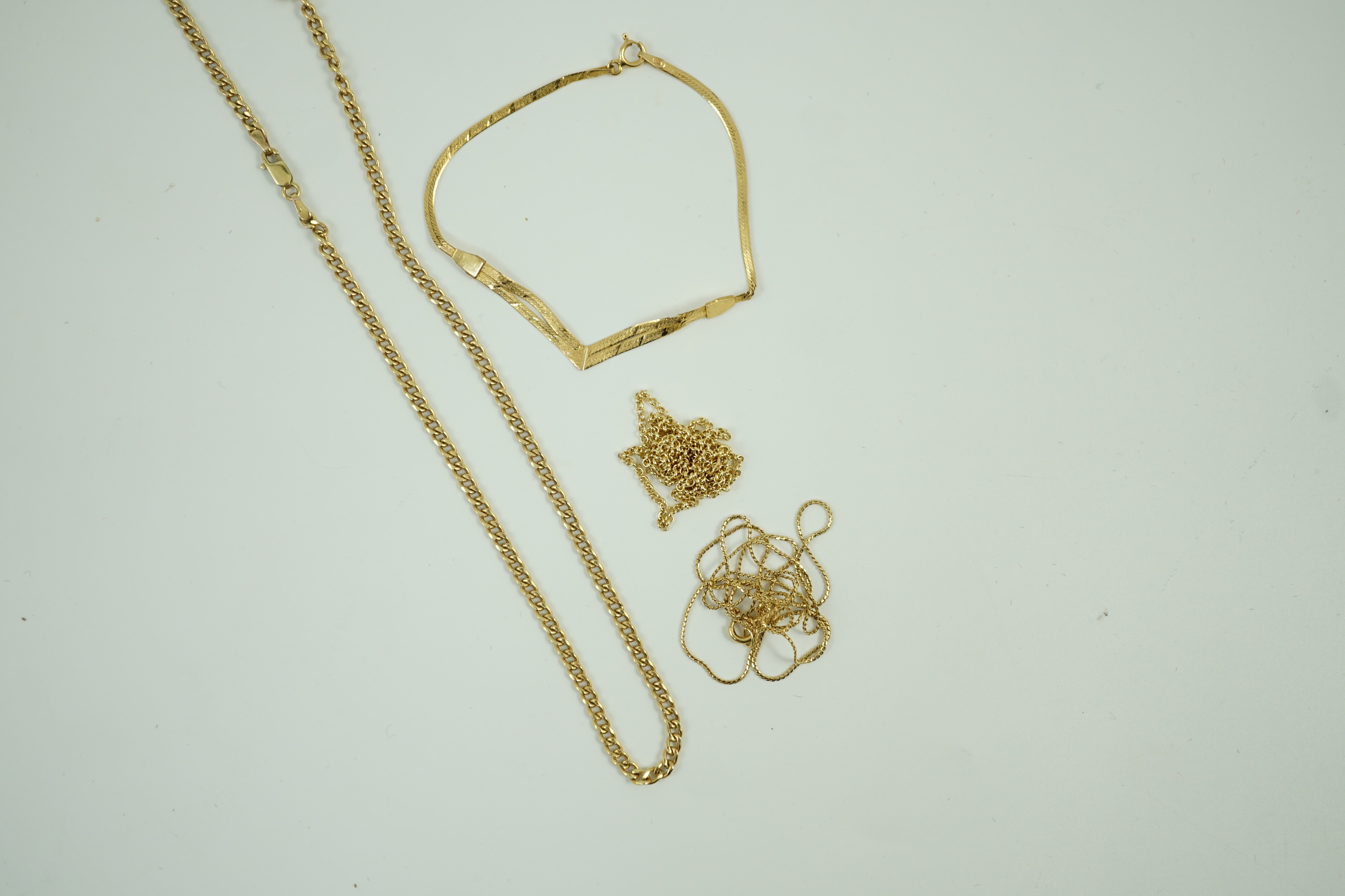 Two modern 9ct gold chains, longest 45cm, 6 grams, a 14kt bracelet, 1.6 grams and a 750 fine link chain, 2.3 grams.